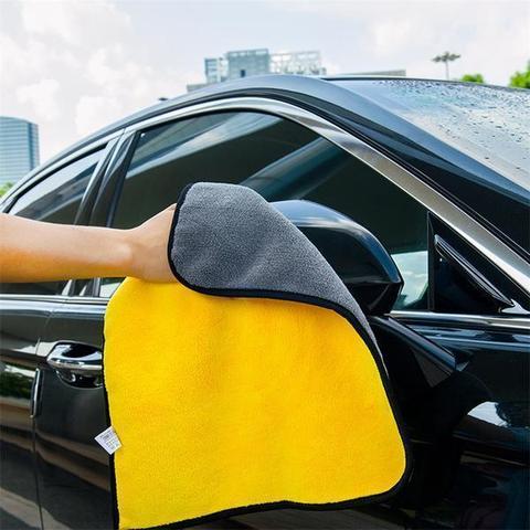 Double-sided microfiber towel used on a vehicle